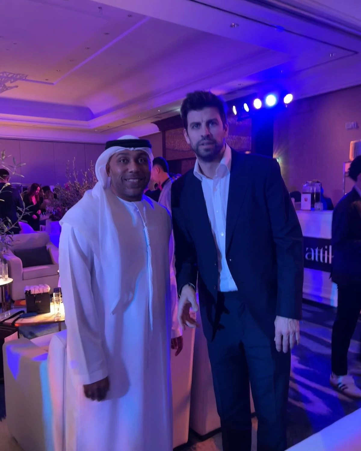 Consultant with attendees at a formal event